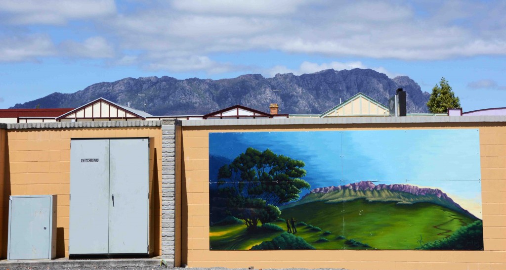 Mural of Mt Roland in Sheffield, Tasmania, With The Real Thing Behind